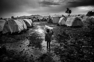 Africa, R.D.C.- North Kivu, Goma. Kanyaruchinya refugee camp. It is, calculated that there are over 60,000 people in this refugee camp, coordinated by the UNHCR, which sprang up in July following the outbreak of war between the M23 rebel movement and the FARDC. Most of the refugees are from the territories of Rutshuru and Kibati, and claim to have suffered violence at the hands of the M23. What everyone in the camp has in common is ethnic hatred towards the Tutsi, the ethnic group the M23 rebels are identified with. 20th October 2012, foto fornita da Volpe&Sain Comunicazione